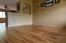 Keep in mind that the stain must be able to penetrate the bare wood, and the excess stain must be wiped from the surface, or it will remain tacky indefinitely. Hickory Floor With Early American Stain