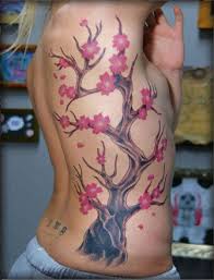 What a gorgeous cherry blossom tattoo design. Lovely Cherry Blossom Tree Tattoo On Ribs Tattooimages Biz