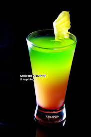 A delicious cocktail recipe for the midori sour cocktail with lime juice, midori, sour mix and lemon lime soda. Midori Sunset Midori Drinks Liquor Drinks Drinks Alcohol Recipes