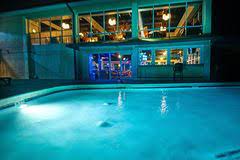 Most hotels in the us don't care about guests bringing in their own guests, whether it is for romance or whatever other activities. A Night Shot Of A Hotel Swimming Pool Stock Photo Image Of Lights Hotel 139785954