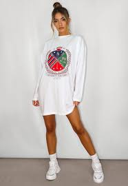 White Oversized Graphic Long Sleeve T Shirt Dress Missguided Opt for a printed long sleeve mini dress to emphasise your pins or a midi dress with a plunging neckline for your big night out! white oversized graphic long sleeve t shirt dress