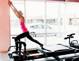 The machine is quite large with many straps, springs, a platform on both ends with a sliding carriage. Lagree Fitness Kim Kardashian S And Sofia Vergara S Pilates Workout Glamour