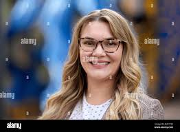 Natalie Rincon poses for a photograph outside a Houston elementary school  Thursday, Nov. 17, 2022, in Houston. Rincon, one of the new social workers,  has seen firsthand the benefit of having a