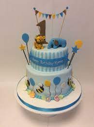 Elegant white & gold 50th two tier birthday cake. 2 Tier 1st Birthday Cake With Animals And Bumble Bees 1st Birthday Cakes Boys 1st Birthday Cake Birthday Cake With Candles