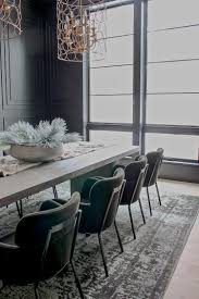 Deciding on a centerpiece for the dining room table can be a bit daunting… how do pick a scene clear glass vase centerpiece on massive wood dining table. Our Bold Black Dining Room Reveal Styled For Christmas The House Of Silver Lining