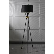 Featuring three stylishly tapered legs, this modern floor lamp is crafted from a combination of metal and wood that ties together any space with chic style. Camden Tripod Floor Lamp