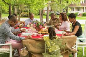 Multi-generation family praying at picnic table - Stock Photo ...
