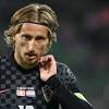 Croatia's midfielder luka modric is congratuled on receiving the golden ball award for best player by croatian president kolinda. 1