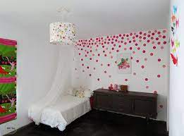 This beautiful coral dresser is made into a focal point with gold polka dots beaming toward it like a spotlight. How To Paint A Polka Dots Wall Ohoh Deco