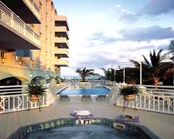 The pale blue and green exterior with white accent design reflects the hues of the ocean, and the dramatic night lighting. Timeshare Details