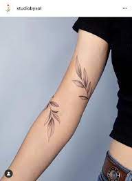 A black rose design that is large and wraps around the hip. Vine Wrap Arm Tattoo Novocom Top
