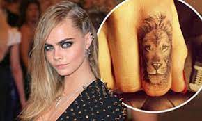 Cara delevingne's first tattoo was a detailed lion's face on her index finger, which she got in may 2013. Cara Delevingne Shows Off New Tattoo Of A Lion On Her Forefinger And Thanks Pal Rihanna For Her Recommendation Daily Mail Online
