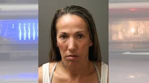 Woman charged with selling heroin in pharmacy parking lot