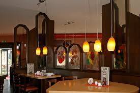 Ein kleiner park umgibt das gebäude. Haus Erika Restaurant Imbiss Hotel Wesel
