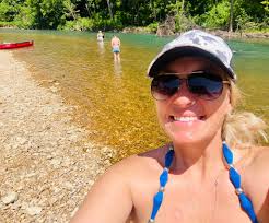 First-time kayakers struggling against the current