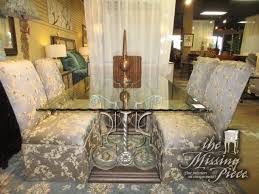 Wave Edge Glass Top Dining Table On An Ornate Base With Six Skirted Parsons Chairs The Two End Chairs Are Do Glass Top Dining Table Parsons Chairs Side Chairs