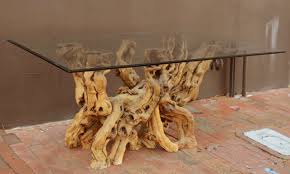 Cypress root driftwood coffee table with kidney shaped smoked glass top. A Cypress Root Base Table At 1stdibs