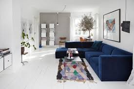 Right now, there are so many ways you can apply in using the combination of the two compatible colors in your living room. Wiltshire Grey Accent Wall Living Room Scandinavian With Blue Sectional Prints And Posters