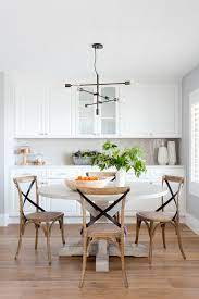 It's crafted from metal in crisp and clean lines, and it's surrounded by a white fabric drum shade with all the breezy charm and texture of linen. Modern Farmhouse Dining Room Decor Ideas Pickled Barrel