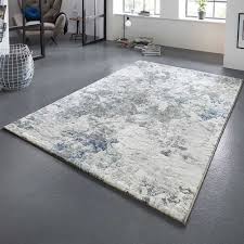 Der teppich ist neuwertig und wurde kaum genutzt. Design Teppich Fontaine Creme Blau Grun Mit Paint Splash Effekt Teppich Boss