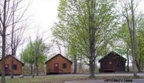 Very comfortable living space with downstairs bedroom, upstairs loft, living room, dining area and large kitchen area with hardwood cabinets, kitchen sink. K G Lodge Twin Pines Cabins Oswego Ny 13126