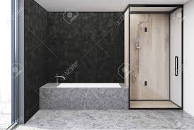 Hex tile is growing popular, thanks to its unusual shape. Dark Gray Bathroom Interior With A Gray Floor An Angular Bathtub Stock Photo Picture And Royalty Free Image Image 91706267