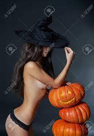 Halloween Sexy Witch Girl In Hat. Beautiful Naked Woman In Witches Hat With  Pumpkin Stock Photo, Picture and Royalty Free Image. Image 67618933.