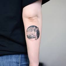 Travel tattoo ideas this lower arm tattoo prominently features an open compass resting on top of a world map. 1001 Ideas For The Adventurous Mountain Range Tattoo