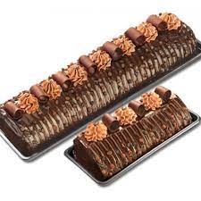 Rich chocolate chiffon roll cake rolfilled with cherry cream and covered with whipped cream and topped with chcolate shavings and cherries. Chocolate Overload Roll By Goldilocks
