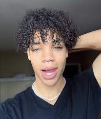 Curly ringlets gracing the kid's forehead and hanging on sides make the sweet cherub a picture of innocence and undiluted charm. Imcoreycampbell Dark Skin Boys Black Boys Haircuts Boys With Curly Hair