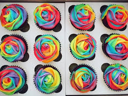Create a cloud of white, vanilla icing on top of your rainbow cupcakes. How To Make Rainbow Frosted Cupcakes