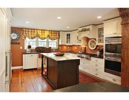 Kitchen With Ivory Cream Cabinets And Burnt Orange Pumpkin Walls Orange Kitchen Walls Kitchen Colors Orange Kitchen