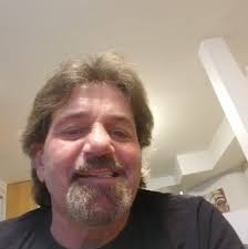 What could be the cause of oil smelling like gasoline in a 94 5.7 TBI  engine?