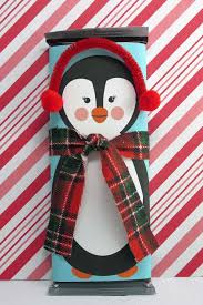 This christmas candy wrapper design is very colorful and adorable and it is decorated with images of a santa standing near a christmas tree with his sack of gifts. Free Printable Penguin Candy Bar Wrappers Scraplifters Com