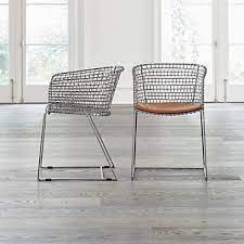Black metal hairpin legs give the. Tig Metal Barrel Dining Chair With Cushion Crate And Barrel