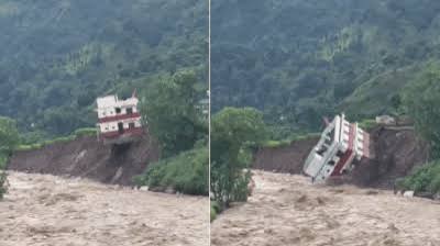 Watch: Government building collapses into river as heavy rains trigger fresh landslide in Nepal - The Times of India