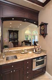 The black walls and kitchen island are black valchromat, a wood fiber based material that is a solid color throughout — what does that mean exactly? Design Opuluxeltd Com Lifestyle Design