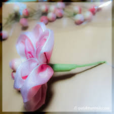 She lit the candles in the three tall black iron candelabras on the long table and drew out a large jual buku menyulam : Bunga Pita Hiasan Dinding Patah Tumbuh