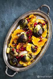 Maple Glazed Roasted Delicata Squash And Brussels Sprouts Recipe Simplyrecipes Com Recipe Delicata Squash Brussel Sprouts Brussels Sprouts Recipe