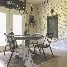 After the stain dried, we used a sander to distress the finish a bunch to give it a weathered look. Faux Brick Wall Modern Farmhouse Decor Farmhouse Dining Room Breakfast Farmhouse Dining Room Modern Farmhouse Dining Room Farmhouse Dining Room Table