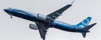 A worker looks up at a parked boeing 737 max 8 built for jet airways as another 737 max 8 made for shenzhen airlines stands behind at a boeing co. Update Boeing 737 Max Flights To Hawaii Restarting