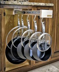 These pot racks keep more space open in your cabinets and look great. The Glideware Sliding Pot Holder Helps You Neatly Store Your Cooking Pots Kokkenideer Kokkenopbevaring Kokkendesign
