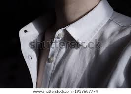 Unbuttoned dress shirt with chain. Shutterstock Puzzlepix