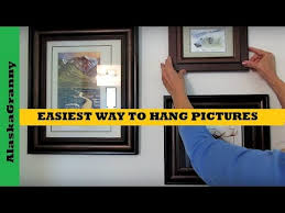 Place painter's tape over the mark. Easiest Way To Hang Pictures Youtube