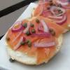 On one half of each bagel, start layering the smoked salmon, toppings, arugula, cucumbers, onions, apples and avocados. Https Encrypted Tbn0 Gstatic Com Images Q Tbn And9gcsfrvz Rqm Udvce5wxrczqugn8uibyfi3hvuztqoqlohnqtnic Usqp Cau