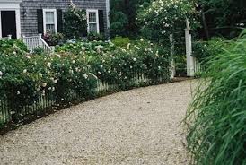 It is a solid driving surface yet it drains water right through it. Driveway Design For Long Lasting Appeal Bob Vila Driveway Design Driveway Landscaping Landscape Design
