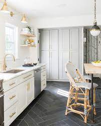 Chevron tile is cut diagonally in the center, so it fits together like the chevron shape. White Grey Brass Kitchen With Herringbone Tile Floor Flooring Ms International Slate Home Depot Dark Kitchen Floors Kitchen Design Kitchen Marble
