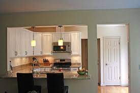 Full remodel, woodflooring, excellent lighting with three long windows that open up this modern living room / dining room. Open Wall Between Kitchen And Dining Room Living Room Kitchen Home Remodeling Home Kitchens
