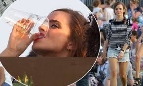 Emma Watson downs her beer at Taylor Swift's Hyde Park festival gig