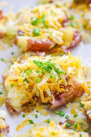 Red potatoes can actually be boiled with the skin still on. These Smashed Potatoes Are Small Red Potatoes Boiled Until Slightly Soft Smashed And Basted With A Potato Side Dishes Potato Side Dishes Easy Greek Potatoes
